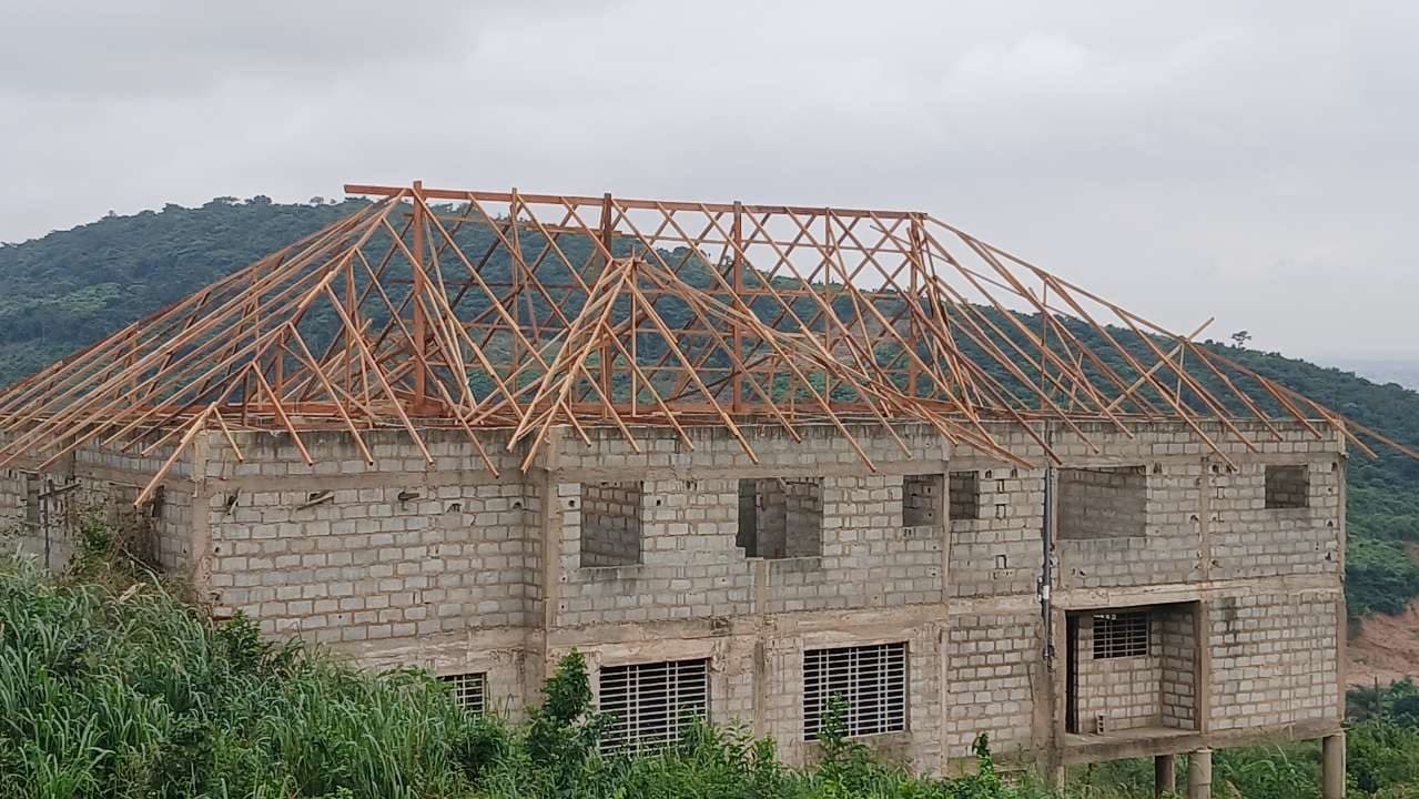 Steel roof truss framing on a two-storey building